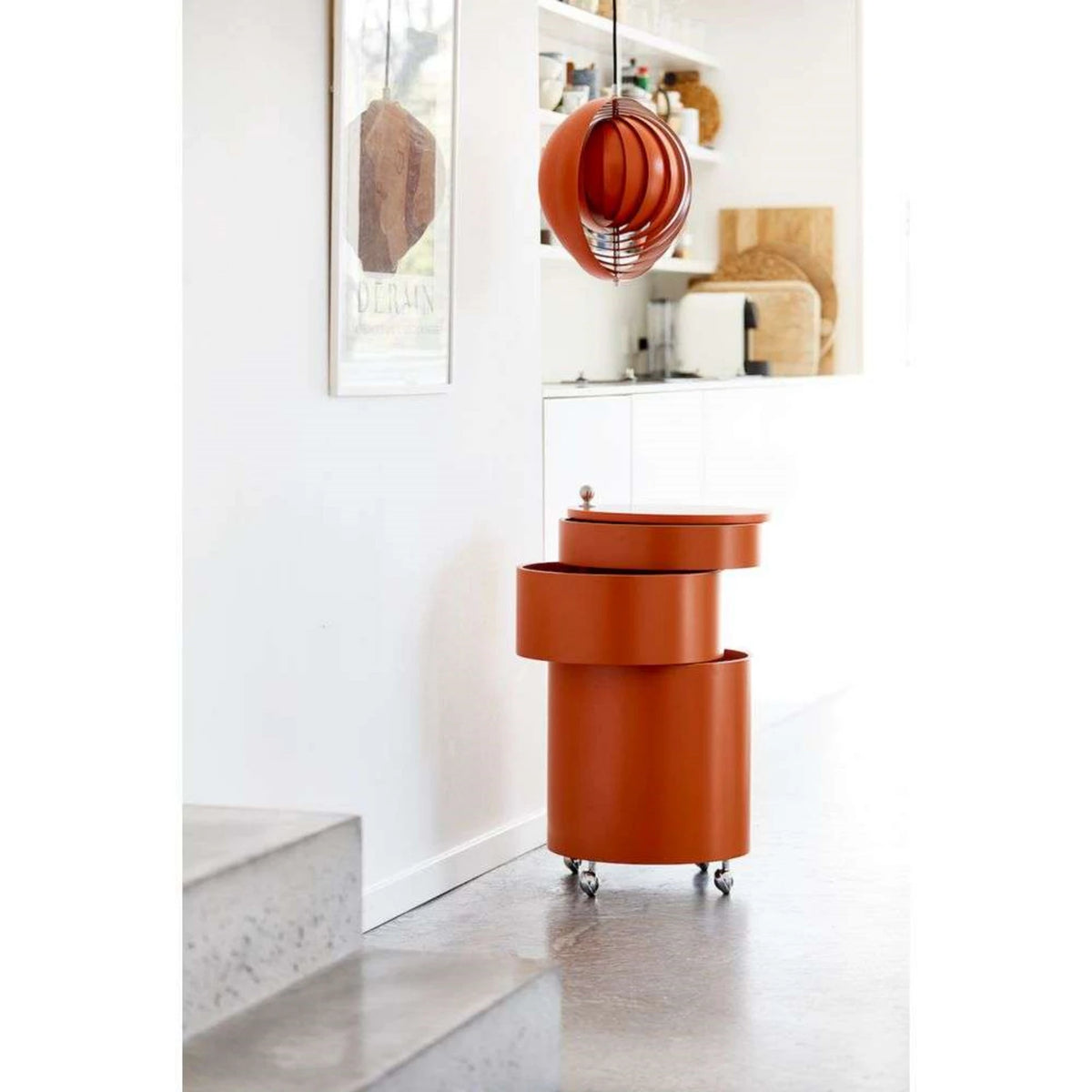 SWIVEL Bar Cabinet — cylindrical, on castors, orange / terracotta